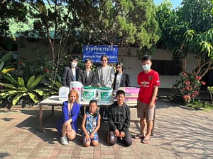 Constant Energy representatives with Ban Than Nam Sai Children's Home community as they make a donation for washing supplies